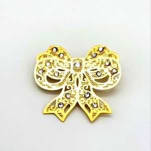 10k gold platted brass bow or ribbon 🎀 pin from the Danbury Mint
